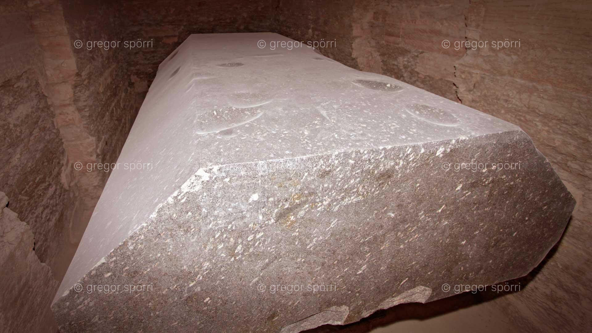 Serapeum Sakkara: A 20-ton coffin lid with various dents and holes polished out.